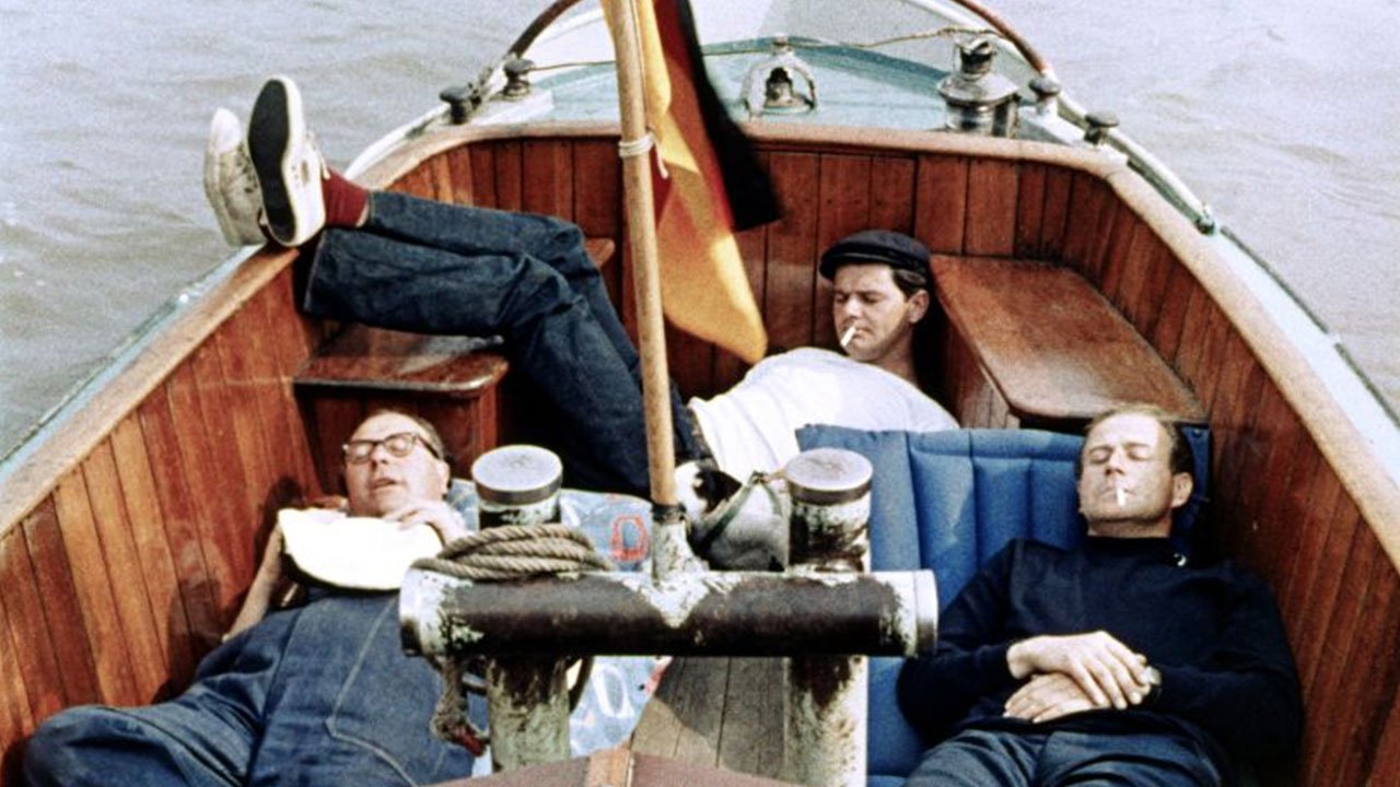 Drei Mann in einem Boot